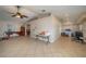 Spacious living room with tile flooring and a ceiling fan for comfort at 2219 New Jersey Rd, Lakeland, FL 33803
