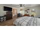 Spacious main bedroom featuring a ceiling fan, storage shelves, and a large window at 2219 New Jersey Rd, Lakeland, FL 33803