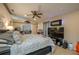 Inviting main bedroom featuring a large bed, ceiling fan, and stylish decor at 2219 New Jersey Rd, Lakeland, FL 33803