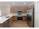 Modern kitchen with stainless steel appliances and a bright countertop at 2331 Northumberland Ct, Haines City, FL 33844