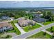 Gorgeous aerial view of the neighborhood with lush surroundings, meticulously landscaped lawns, and beautiful homes at 2662 Delphi Hills Ct, Lakeland, FL 33812