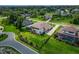 Expansive aerial view of a luxury home with well-manicured lawn, landscaping and circular driveway at 2662 Delphi Hills Ct, Lakeland, FL 33812