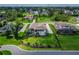 Sweeping aerial view of a landscaped backyard and sparkling pool in a lush green surrounding at 2662 Delphi Hills Ct, Lakeland, FL 33812