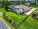 Aerial view of a home showcasing the vast, well-manicured backyard and extended driveway at 2662 Delphi Hills Ct, Lakeland, FL 33812
