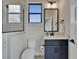 Modern bathroom with sleek vanity, framed mirror, glass-enclosed shower, and contemporary fixtures at 2662 Delphi Hills Ct, Lakeland, FL 33812