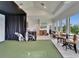 Spacious room with golf simulator, and an entertainment area for a comfortable at home experience at 2662 Delphi Hills Ct, Lakeland, FL 33812