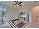 Bright exercise room with lots of space, tv, shelving, and view of backyard at 2662 Delphi Hills Ct, Lakeland, FL 33812