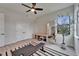 Exercise room with light flooring, ample space, large mirror, and view of backyard at 2662 Delphi Hills Ct, Lakeland, FL 33812