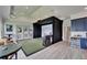 Spacious room featuring a state-of-the-art golf simulator with a large screen and dark privacy curtains at 2662 Delphi Hills Ct, Lakeland, FL 33812