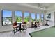 Bright and airy golf simulation space with views of the tree tops at 2662 Delphi Hills Ct, Lakeland, FL 33812