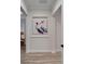 Hallway with a pelican art piece hanging in the hallway at 2662 Delphi Hills Ct, Lakeland, FL 33812