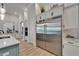 Modern kitchen features stainless steel appliances, marble counters, and wood flooring at 2662 Delphi Hills Ct, Lakeland, FL 33812