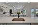 Spacious kitchen island with light countertops, ample storage, and backyard pool view at 2662 Delphi Hills Ct, Lakeland, FL 33812