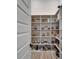 Walk-in pantry with plentiful shelving for organized storage and easy access at 2662 Delphi Hills Ct, Lakeland, FL 33812