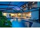 Relaxing outdoor pool and lanai area, complete with spa, comfortable seating and a second-story balcony at 2662 Delphi Hills Ct, Lakeland, FL 33812
