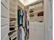 Bright walk-in closet with custom shelving and ample storage space for clothing and accessories at 2662 Delphi Hills Ct, Lakeland, FL 33812