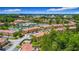 A beautiful aerial view of a lakeside resort community with pool and water slide amenities, near a famous theme park at 2683 Corvette Ln, Kissimmee, FL 34746