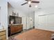 Main bedroom with closet, dresser, and contemporary ceiling fan at 2683 Corvette Ln, Kissimmee, FL 34746
