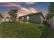 Spacious backyard with well-maintained lawn and white vinyl fencing offering privacy at 280 Pershing St, Bartow, FL 33830