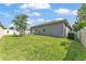 Spacious backyard with well-maintained lawn and white vinyl fence creating a private outdoor retreat at 280 Pershing St, Bartow, FL 33830