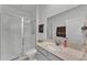 Bathroom featuring a walk-in shower, vanity with storage, and neutral paint tones at 280 Pershing St, Bartow, FL 33830