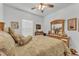 Inviting bedroom showcasing bed with decorative pillows and large dresser with mirror at 280 Pershing St, Bartow, FL 33830