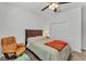 Comfortable bedroom with a ceiling fan, and includes an armchair and closet space at 280 Pershing St, Bartow, FL 33830