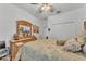 Cozy bedroom with comfortable bed, large dresser with mirror, and double door closet at 280 Pershing St, Bartow, FL 33830