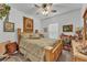 Comfortable bedroom with natural light, ceiling fan, and neutral decor for relaxation at 280 Pershing St, Bartow, FL 33830