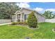 Beautifully landscaped home with lush green lawn, complemented by attractive landscaping features at 280 Pershing St, Bartow, FL 33830