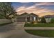 Charming single-story home featuring a manicured lawn, stone accents and an attached two car garage at 280 Pershing St, Bartow, FL 33830