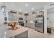 Well-equipped kitchen with stainless steel appliances and ample gray cabinet storage space at 280 Pershing St, Bartow, FL 33830