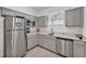 Kitchenette with stainless appliances, attractive counter tops and cabinetry, plus a window for natural light at 280 Pershing St, Bartow, FL 33830