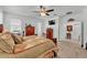 Inviting main bedroom features a large bed, carpeted flooring, and ample natural light at 280 Pershing St, Bartow, FL 33830