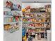 Organized pantry with shelves filled with various food items and supplies for convenient storage at 280 Pershing St, Bartow, FL 33830