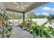 Enjoy this tiled porch with a ceiling fan and many plants that create a refreshing atmosphere at 280 Pershing St, Bartow, FL 33830