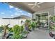 Enjoy this tiled porch with a ceiling fan and many plants that create a refreshing atmosphere at 280 Pershing St, Bartow, FL 33830