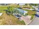 A bright home with well-maintained landscaping and a brick driveway, creating a welcoming curb appeal at 3016 Wood Duck Dr, Polk City, FL 33868