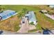 A residential property with a well-manicured lawn and brick driveway, offering a picturesque setting at 3016 Wood Duck Dr, Polk City, FL 33868