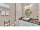 Stylish bathroom with modern vanity, updated fixtures, and large, framed mirror at 3016 Wood Duck Dr, Polk City, FL 33868