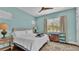 Comfortable bedroom with ceiling fan, natural light, and neutral decor at 3016 Wood Duck Dr, Polk City, FL 33868