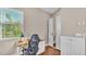 Home office area featuring a desk, rolling chair, closet, and window at 3016 Wood Duck Dr, Polk City, FL 33868