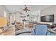 Bright, open living room showcasing the open-concept design and seamless flow to kitchen at 3016 Wood Duck Dr, Polk City, FL 33868
