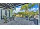 A lovely outdoor patio features a dining area, grill, and scenic views of the surrounding landscape at 3016 Wood Duck Dr, Polk City, FL 33868