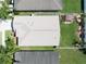 Aerial shot shows property with a new roof and landscaped backyard, nestled between neighboring homes at 3873 Hampton Hills Dr, Lakeland, FL 33810