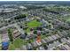 A high-angle aerial view shows how a house is positioned within a well-developed suburban neighborhood at 3873 Hampton Hills Dr, Lakeland, FL 33810