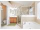Bright bathroom features a soaking tub, glass shower, vanity, and toilet at 3873 Hampton Hills Dr, Lakeland, FL 33810