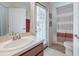Bathroom includes a vanity, sink, toilet, and shower/tub combination with a curtain at 3873 Hampton Hills Dr, Lakeland, FL 33810