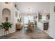 Bright dining area with natural wood furniture adjacent to the modern, gray kitchen at 3873 Hampton Hills Dr, Lakeland, FL 33810