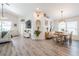 Open-concept living and dining area with modern furniture, creating an inviting and spacious atmosphere at 3873 Hampton Hills Dr, Lakeland, FL 33810